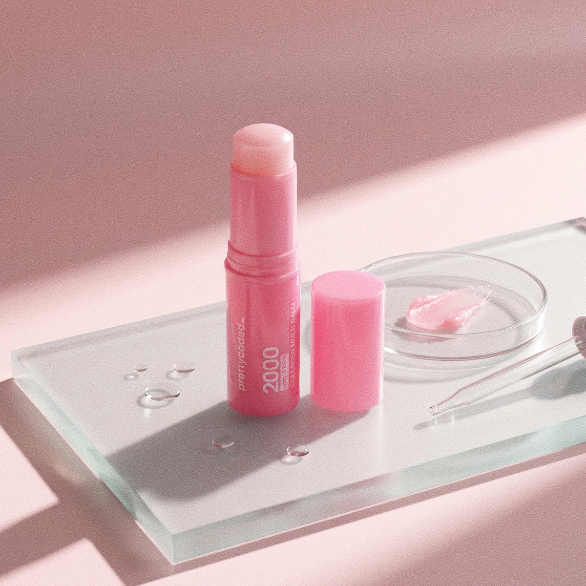 prettycoded balm stick on glass with a swatch of the balm